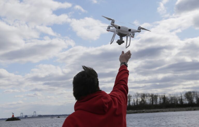 a man flyes a drone in New York