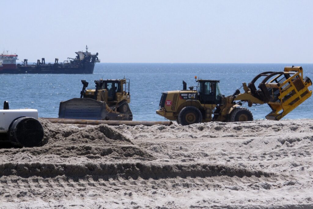 Jersey Shore Beach Replenishment bulldozers on the beach doing replenishment work