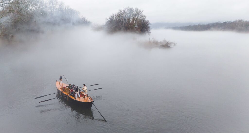 a boat on a river covered in mist