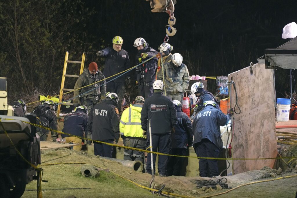 Missing Woman Sinkhole Search Rescue workers search in sinkhole