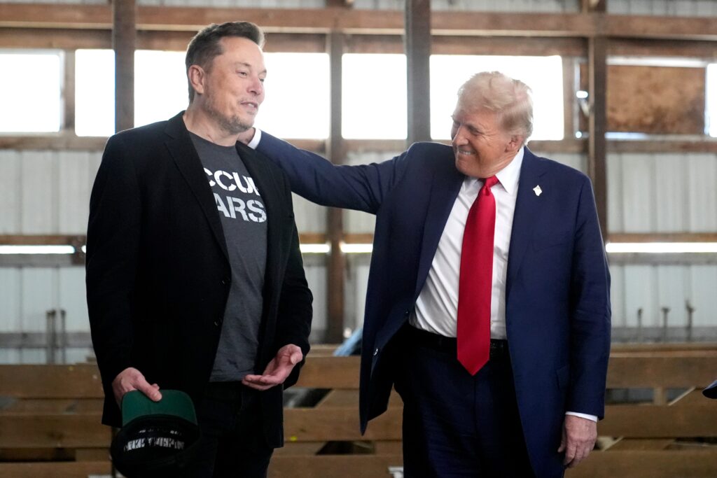 donald-trump-elon-musk-2024-10-05 Donald Trump pats Elon Musk on the shoulder