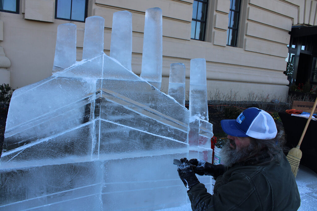 fishtown-freeze-10 copy Roger Wing carves an ice sculpture of The Battery in a live ice sculpting demonstrations at the 6th annual Fishtown Freeze event on Dec. 14, 2024. (Emily Neil/WHYY)