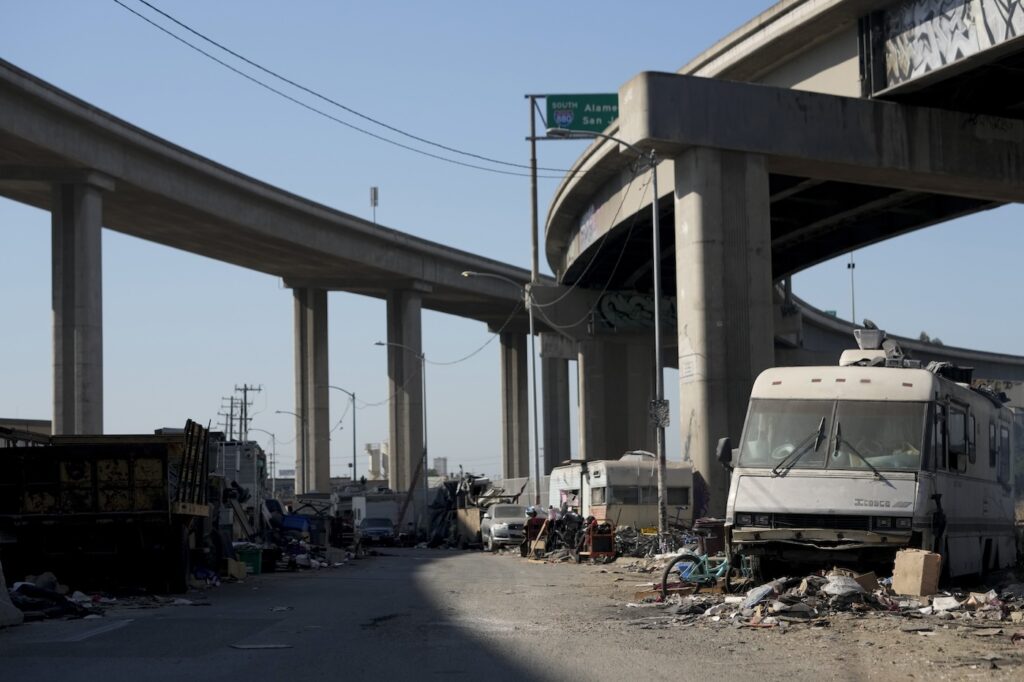 Homeless encampment under a highway overpass