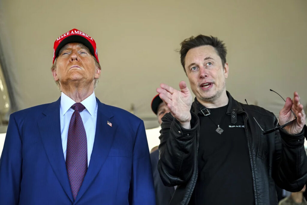 npr_elon copy President-elect Donald Trump listens to Elon Musk as he arrives to watch SpaceX's mega rocket Starship lift off for a test flight from Starbase in Boca Chica, Texas, on Nov. 19. (Brandon Bell/Pool via AP)