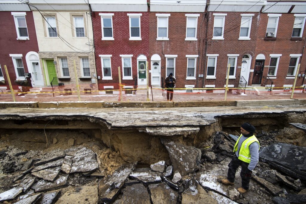 Sinkhole Surge Workers inspect a sinkhole in Philadelphia