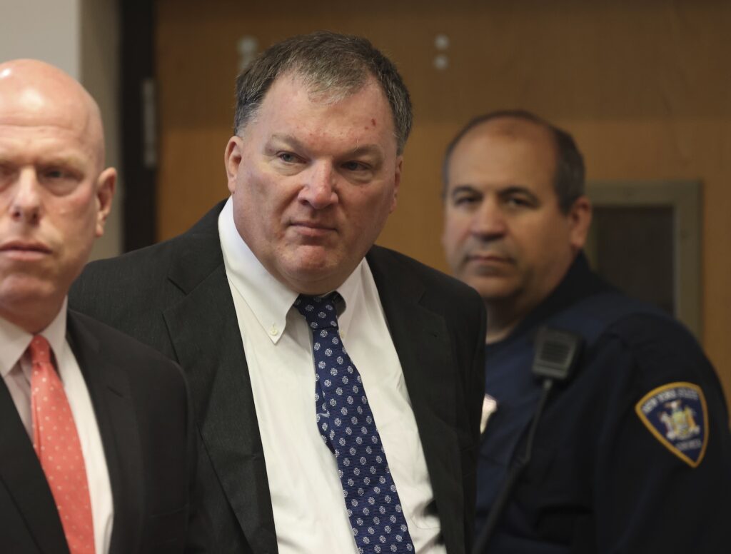 Gilgo Beach Serial Killings Rex Heuermann, center, charged in the Gilgo Beach serial killings on Long Island, appears for a hearing, Tuesday, July 30, 2024, at Suffolk County Court in Riverhead, N.Y.