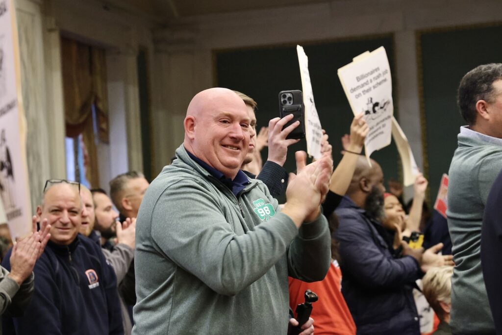 sixers-arena-vote-philadelphia-city-council-supporter-EL-121224 Supporters standing and clapping in the audience