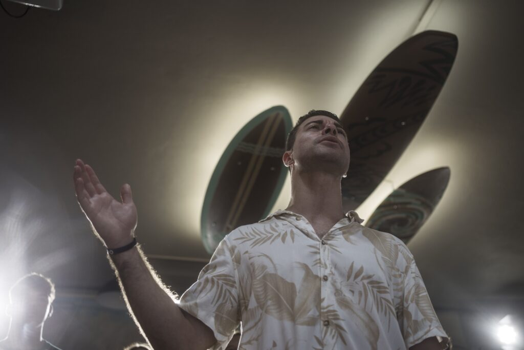 Surf Church pastor, Rev. Samuel Cianelli, preaches to his congregation at the church in Porto