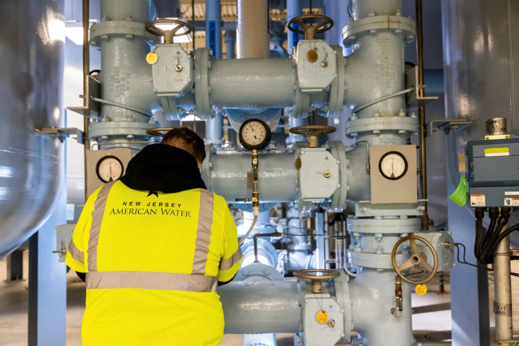 water-filtration-system-pfas-new-jersey-american-water A worker is seen next to a water filtration system