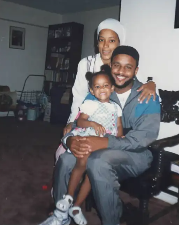 Old photograph of WIlson-Anton when she was a child, posing with her parents