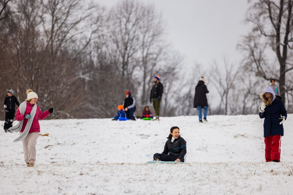 01 06 2025 k paynter snow january 6 2025-11 children sledding down a snowy hill