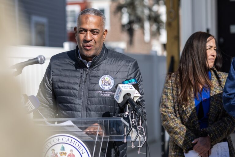 Victor Carstarphen speaking at a podium