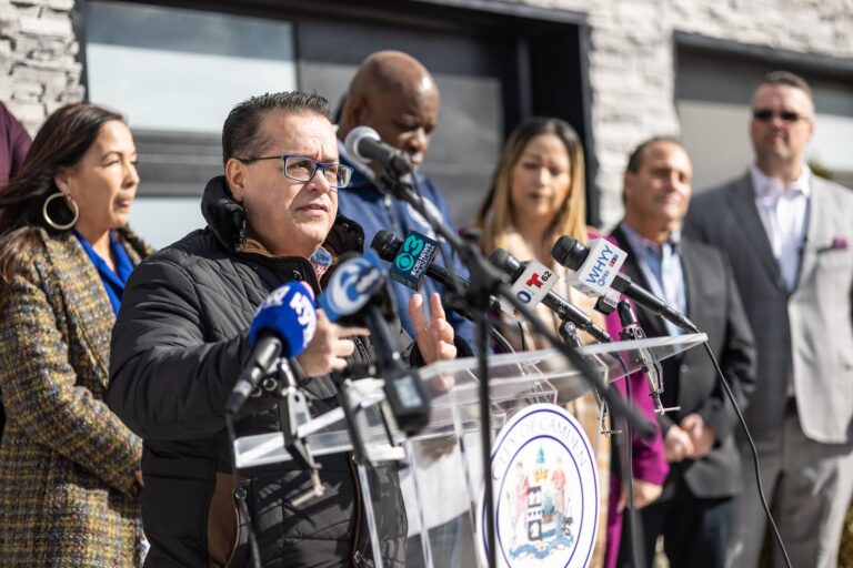 Angel Fuentes speaking at a podium