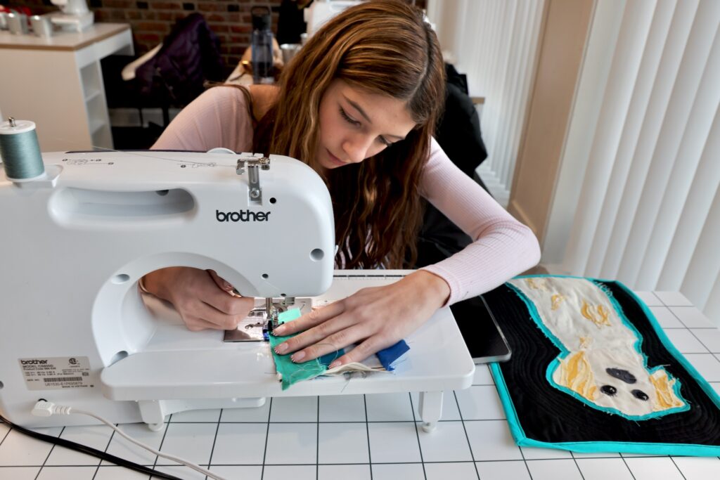 2025 01 08-e lee-iris van orden-philadelphia mount airy cut and sew phl-sewing class Iris Van Orden works on a quilt