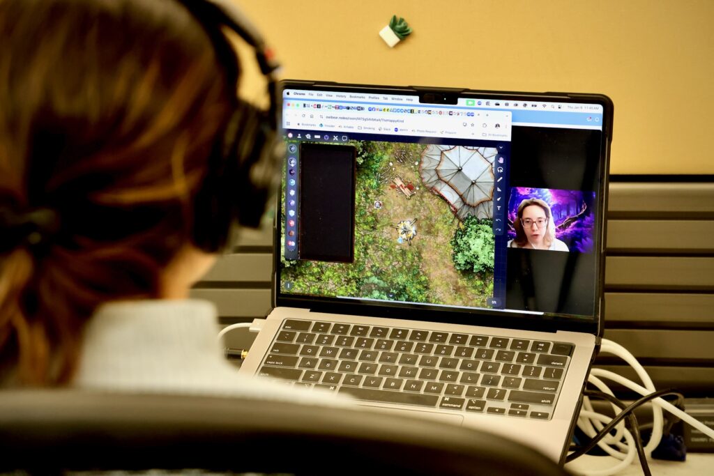 2025 01 09-e lee-nicole leonard katrina serrano-philadelphia whyy-dungeons and dragons therapy camp scene someone playing the game on a computer