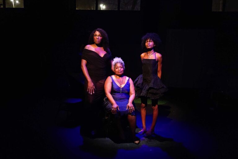 Janelle Luster, Pamela A. Hooks and Nikki Edwards look on