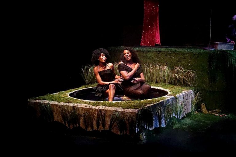 Nikki Edwards and Janelle Luster singing onstage