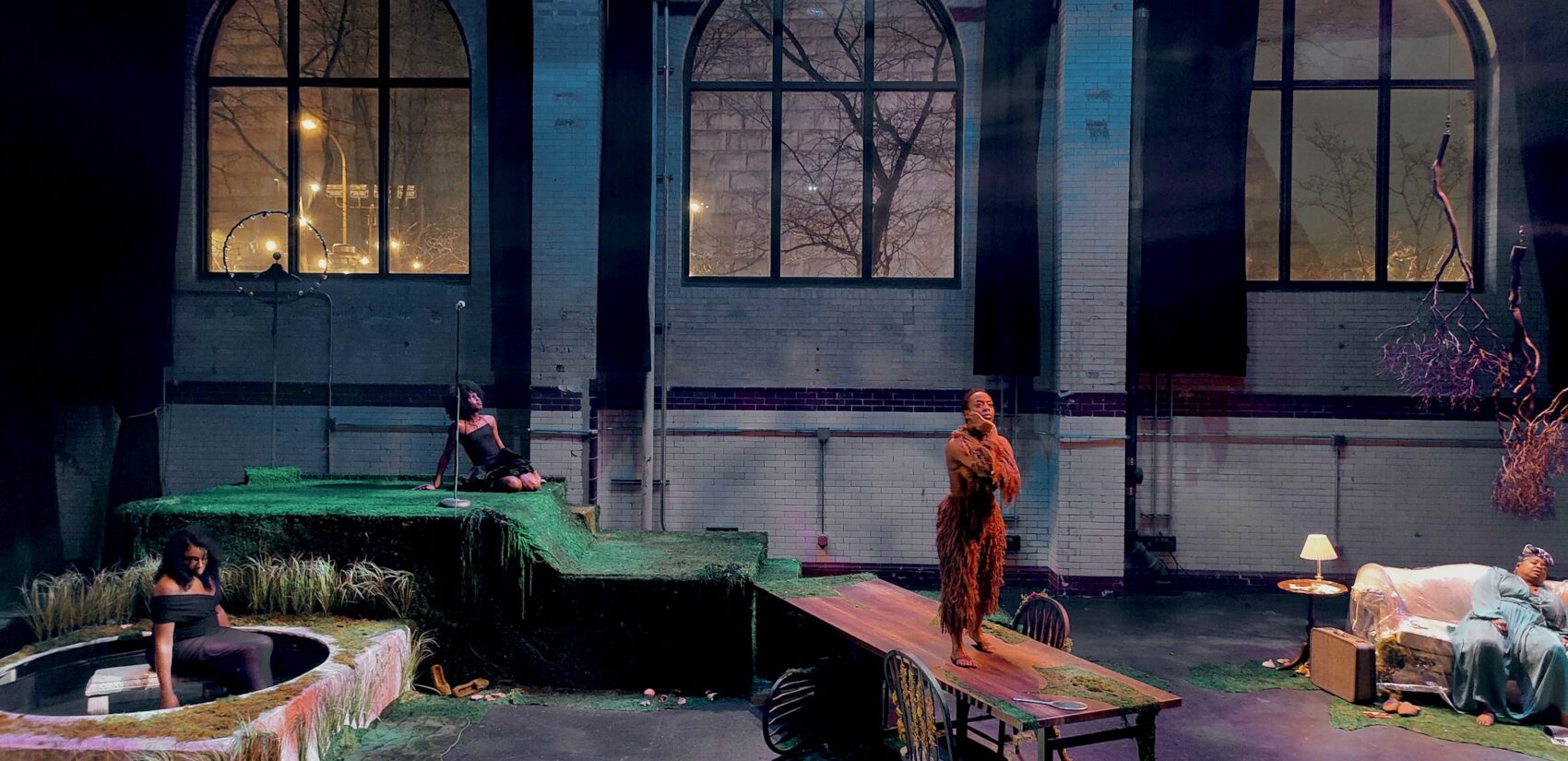 four actors onstage performing