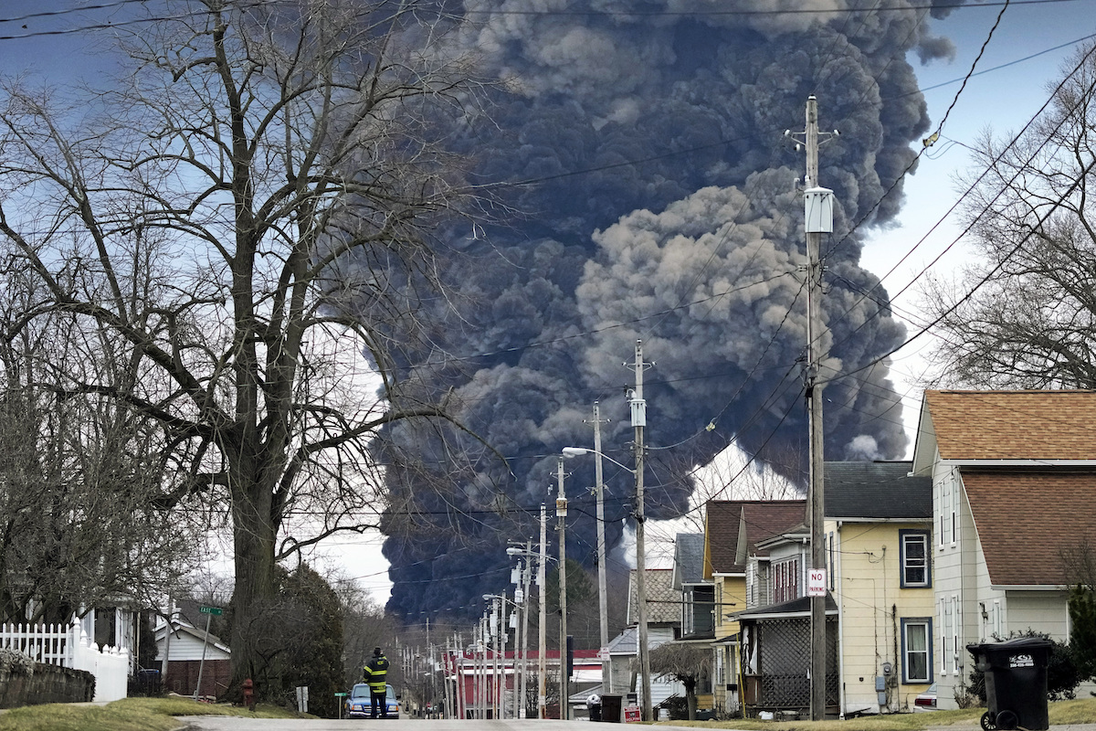 A black plume rises over East Palestine, Ohio, as a result of the controlled detonation of a portion of the derailed Norfolk Southern trains Monday, Feb. 6, 2023. (AP Photo/Gene J. Puskar, File)