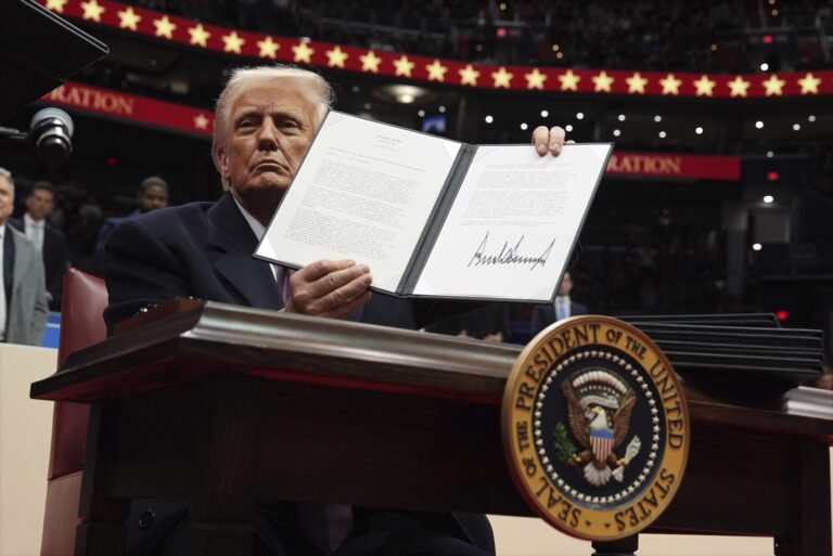 Trump holding up an executive order