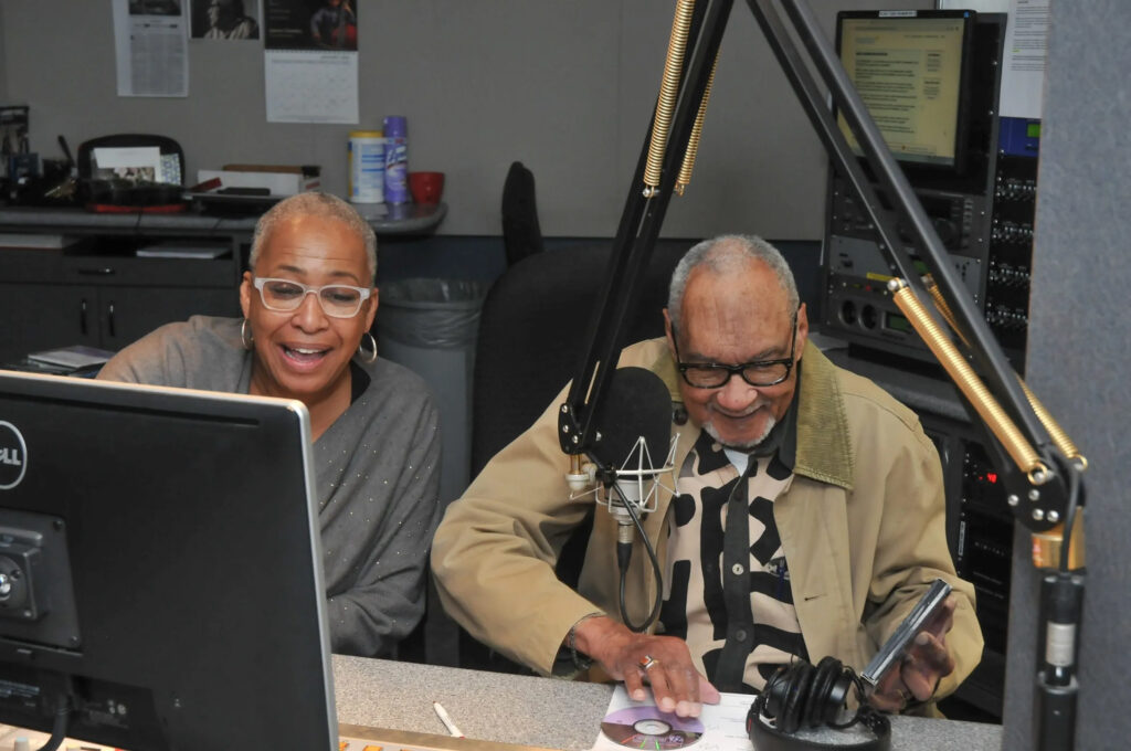 WHYY's own Bobbi Booker, then serving as a producer, with Bob Perkins at WRTI studio. (Photo credit: Martin Regusters)
