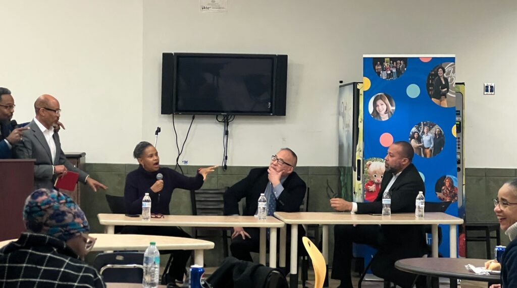 MLK Day-Celia Bernhart-2025-01-16 Panelists sitting at a table during a conversation