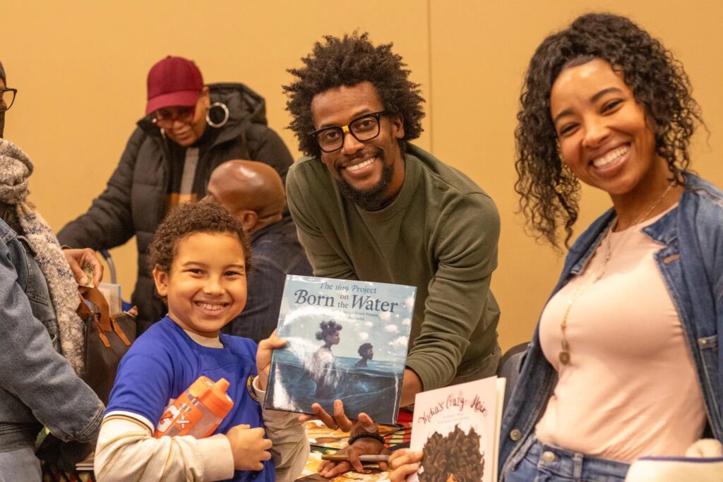 african-american-book-fair-philadelphia families smile at the fair