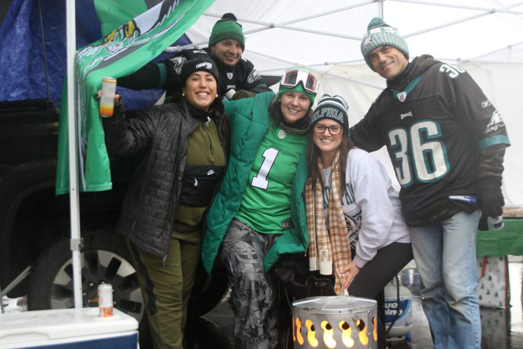 eagles-tailgate-2025-01-19-4 Five Eagles fans smile for a picture