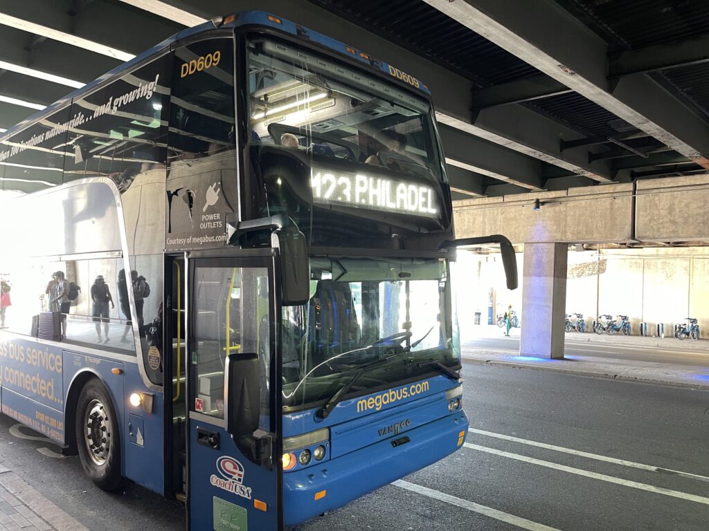 megabus-2024-08-29 Megabus parked under a bridge