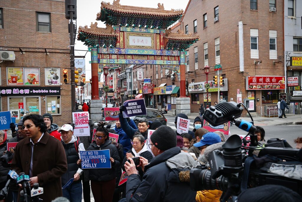 sixers-arena-opponents-3-2025-01-13 Arena opponents gather and hold signs reading NO ARENA IN CHINATOWN and MEDICAL WORKERS SAY NO ARENA