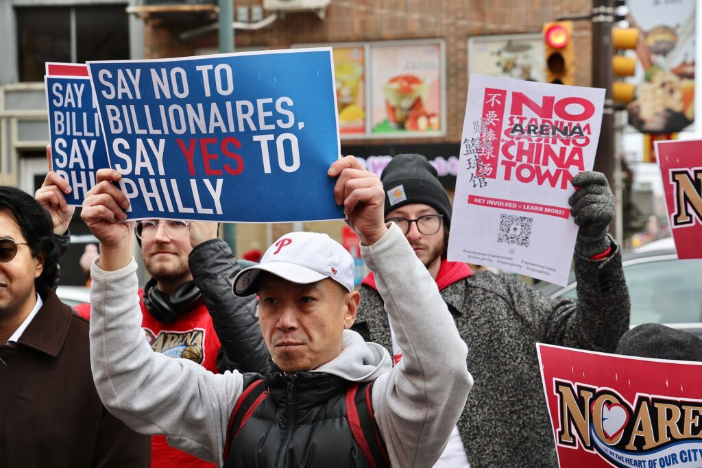 sixers-arena-opponents-4-2025-01-13 Arena opponents gather and hold signs reading NO ARENA IN CHINATOWN and SAY NO TO BILLIONAIRES, SAY YES TO PHILLY