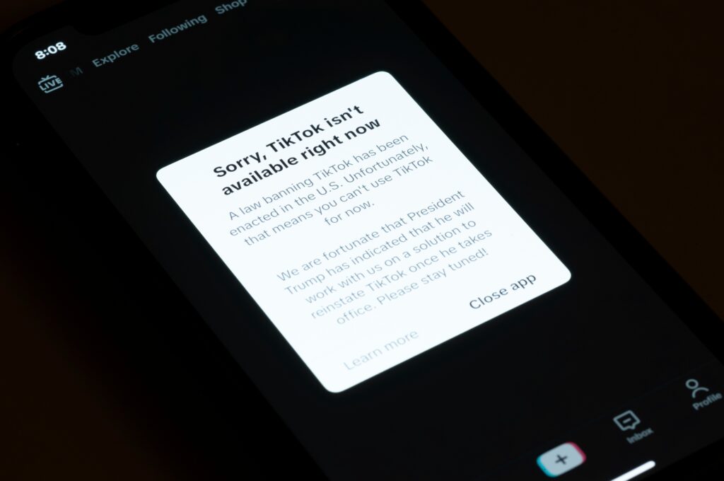 tik-tok-ban-not-available-2025-01-18 A message reading Sorry, TikTok isn't available right now is displayed from the TikTok app on a cell phone screen