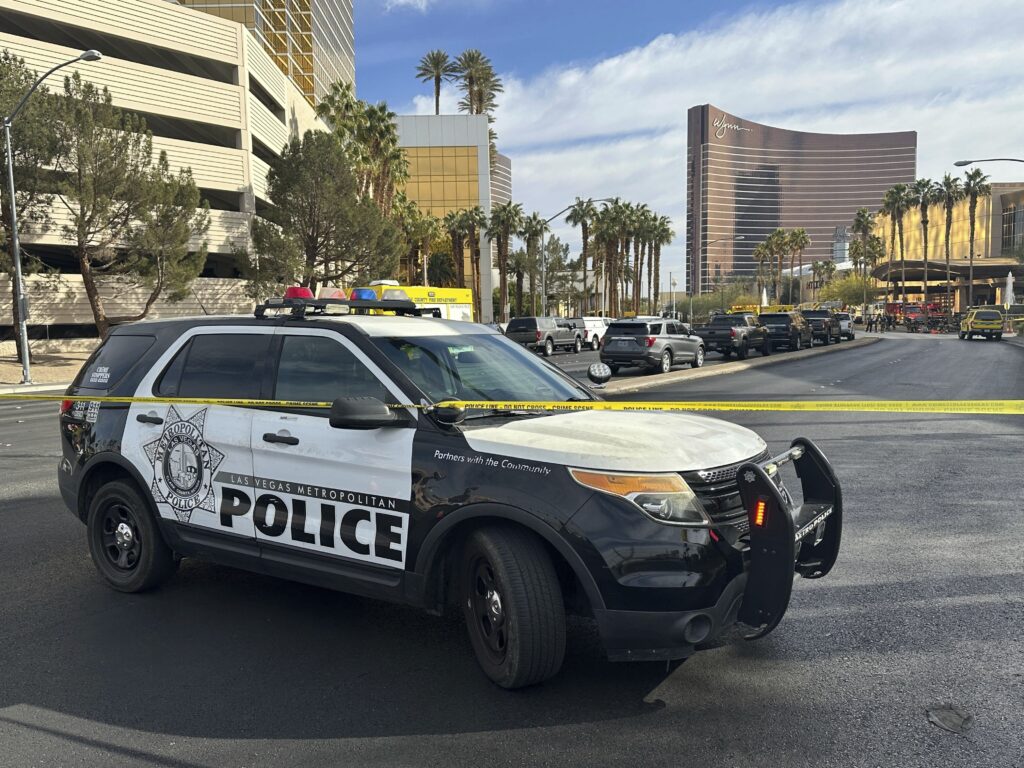 Trump Hotel-Fire-Las Vegas Police block the area after a vehicle caught fire and exploded outside the lobby of President-elect Donald Trump's hotel Wednesday, Jan. 1, 2025.
