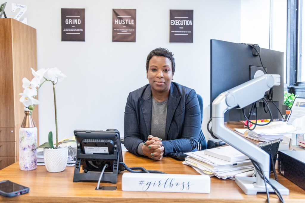 Ayanna Greene-Davis sitting at her desk