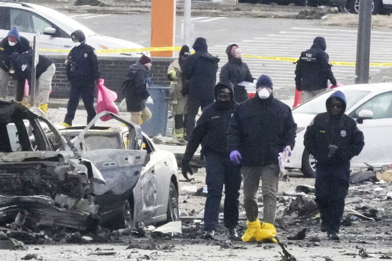Investigators on the ground at the site of the plane crash
