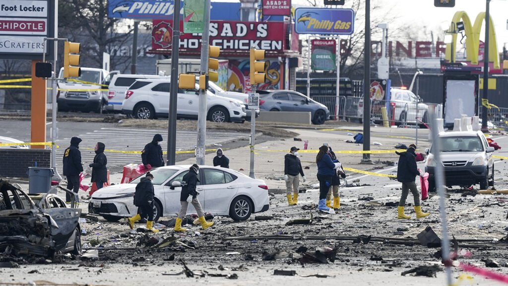 Philadelphia Small Plane Crash Investigators on the ground at the site of the plane crash