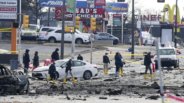 Investigators on the ground at the site of the plane crash