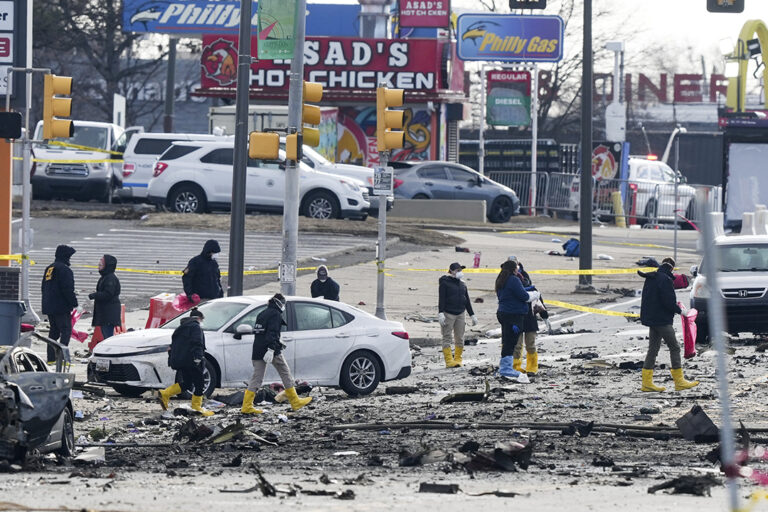 Investigators on the ground at the site of the plane crash