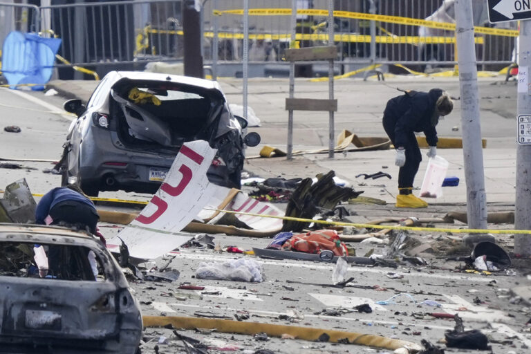 Investigators on the ground at the site of the plane crash