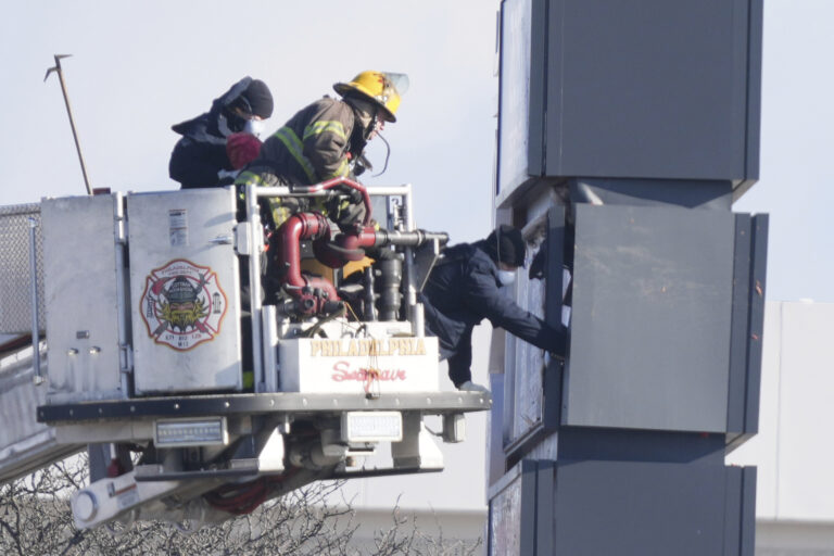 Investigators on the ground at the site of the plane crash