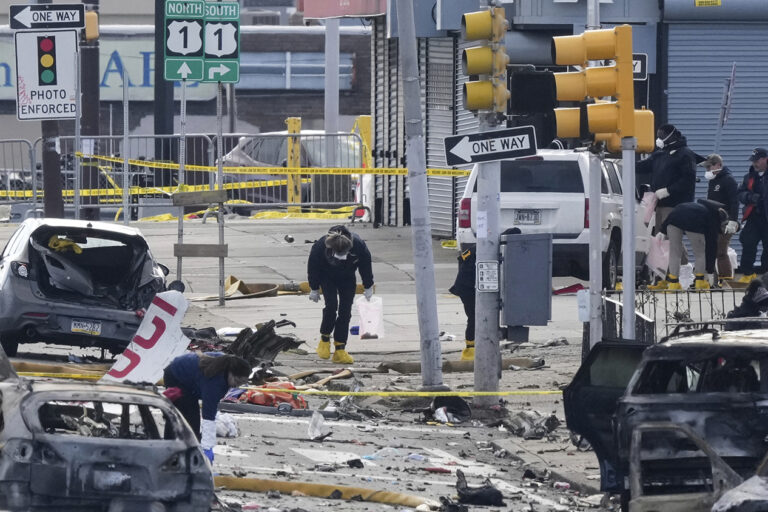 Investigators on the ground at the site of the plane crash