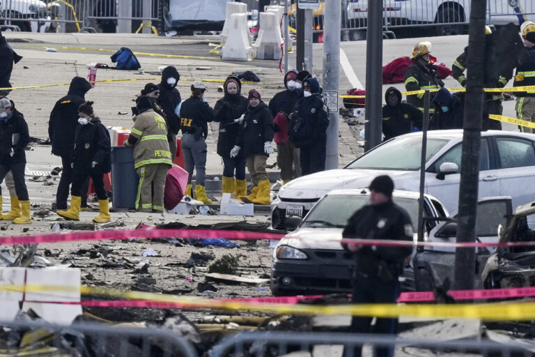 Investigators work the scene of the crash