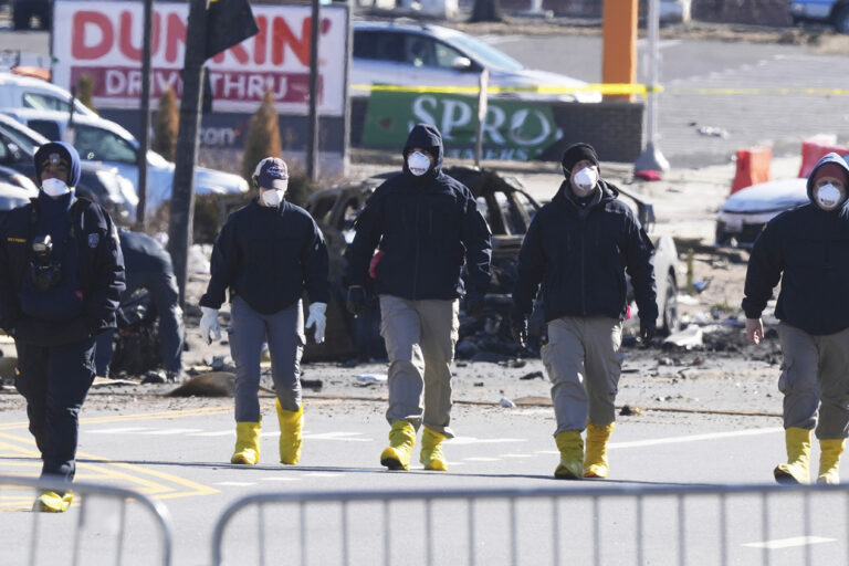 Investigators on the ground at the site of the plane crash