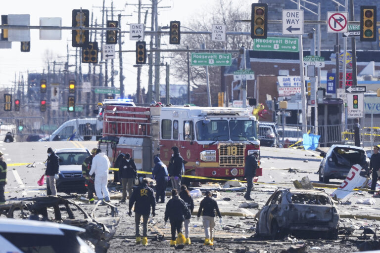 Investigators on the ground at the site of the plane crash