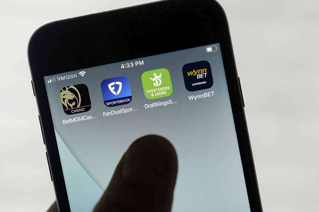 Sports Betting-Risky Business FILE - FanDuel, DraftKings and other online gambling apps are displayed on a phone in San Francisco, Sept. 26, 2022. (AP Photo/Jeff Chiu, File)