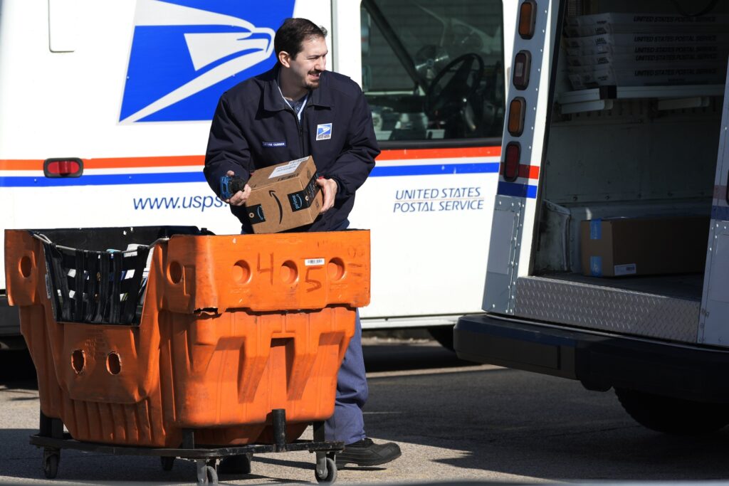 China USPS A postal worker loading up a mail truck