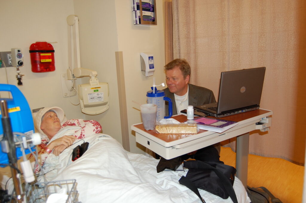 Healthtree Blood cancer patient Jenny Ahlstrom and her husband Paul wait together in the hospital as Jenny prepares for a stem cell transplant treatment. (Courtesy of Jenny Ahlstrom)