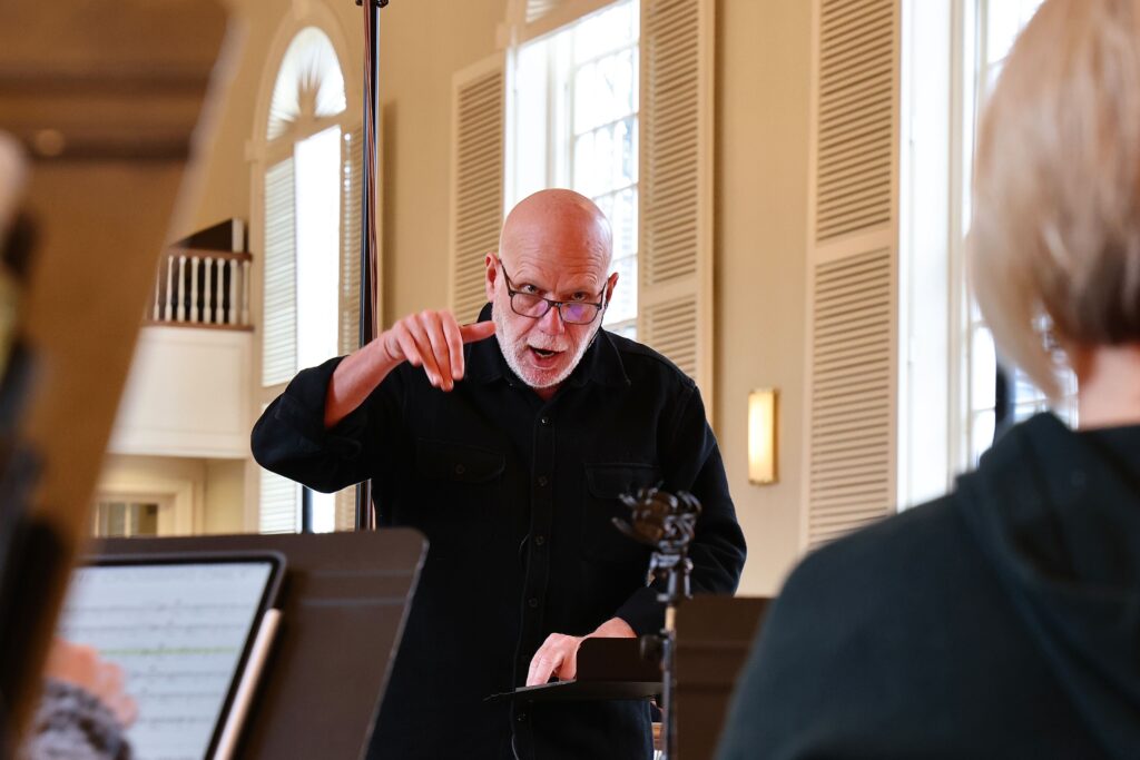 Donald Nally leading a choir