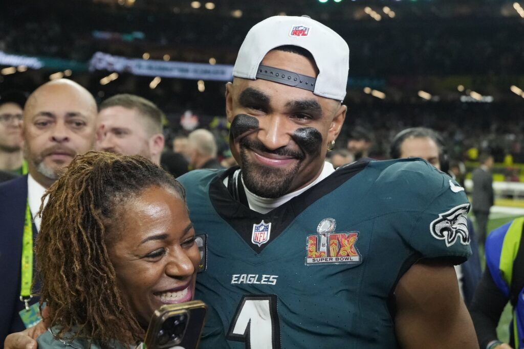 Jalen Hurts celebrates with his mother
