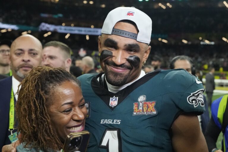 Jalen Hurts celebrates with his mother